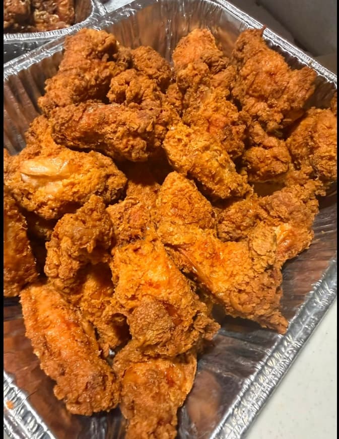 Pan of golden fried chicken